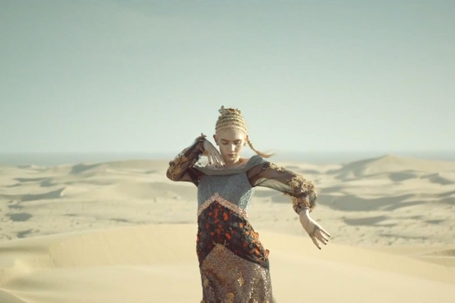 Grimes takes on deserts, space and alien life forms in 'Go' video